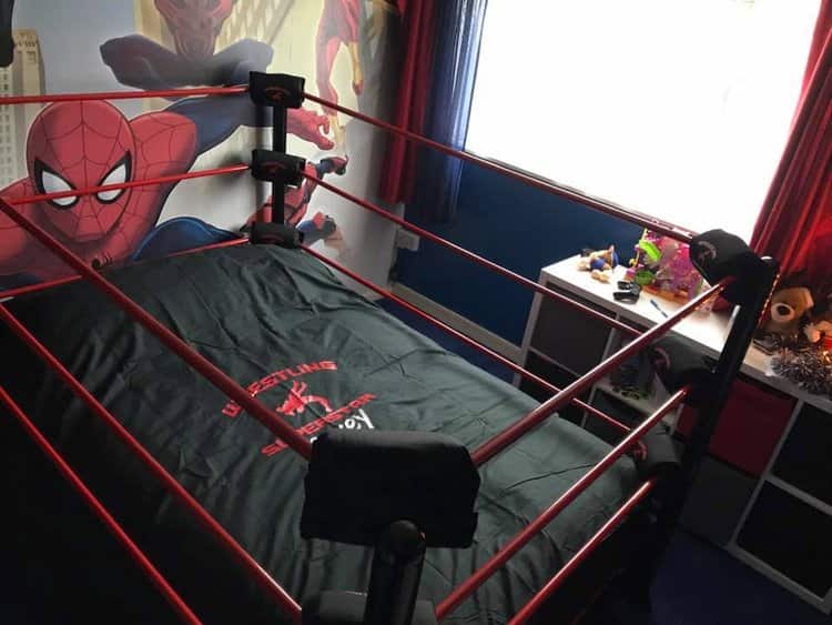 a custom boxing ring bed with a black and red accent
