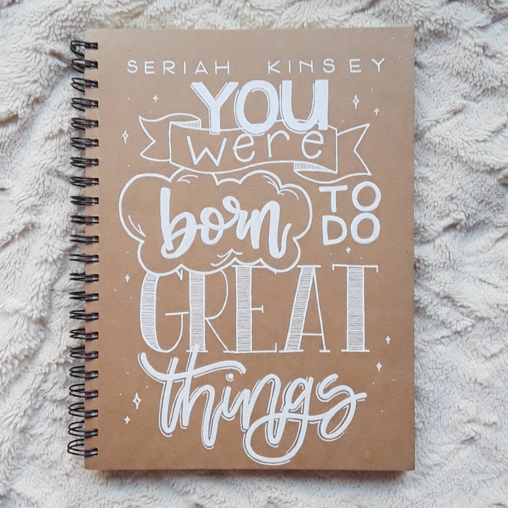 motivational quote on sketchbook cover