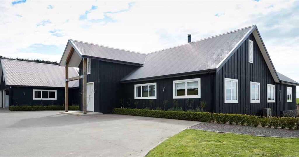 large black house with white trims on windows and door