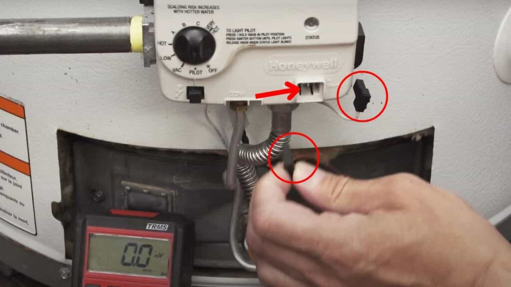step 2 of testing voltage across thermocouple, removing wires