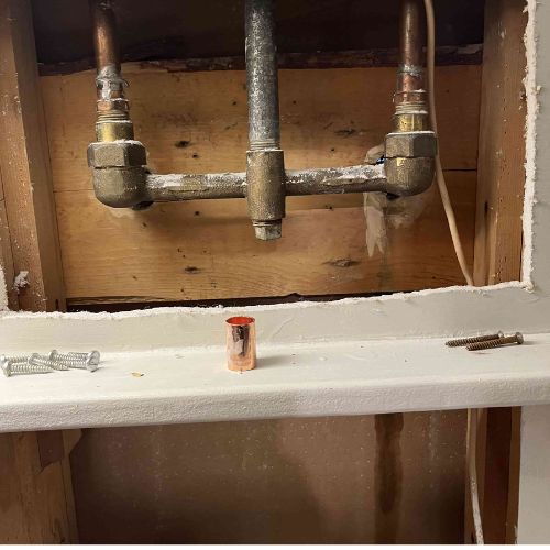 an image of old two handle shower valve