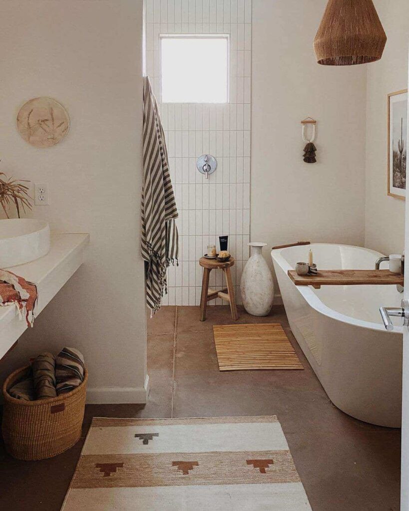 an image of a minimalist and relaxing 10x10 bathroom with spa whirlpool bath, toilet and sink