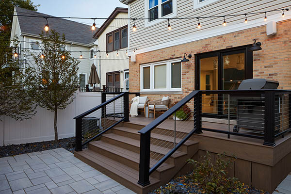 an image of a tan house with black front porch