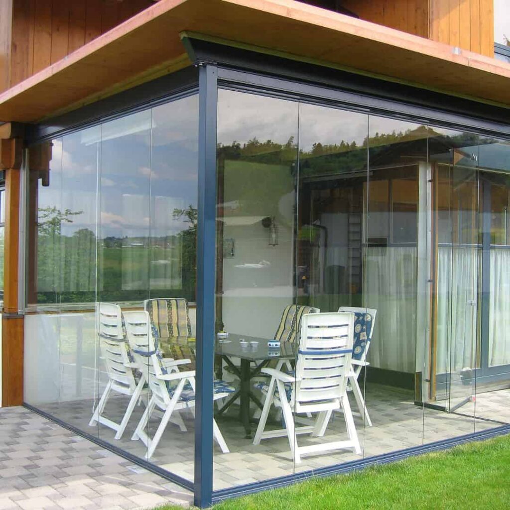 an enclosed patio roof with glass siding