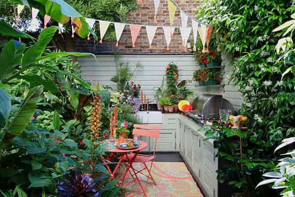 a small outdoor kitchen in a garden