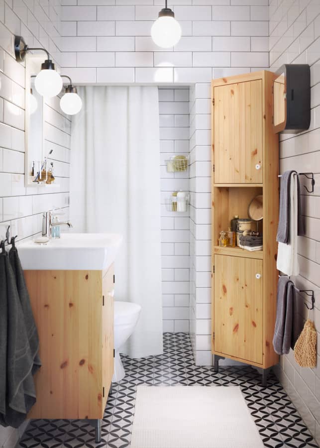 an image of a smartly organized 10x10 bathroom design with vanity, toilet, and small wooden closet