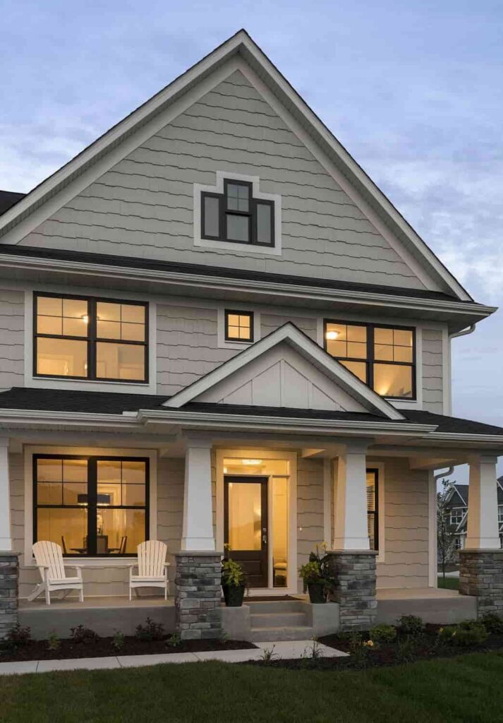 an image showing Tan house with black window trim