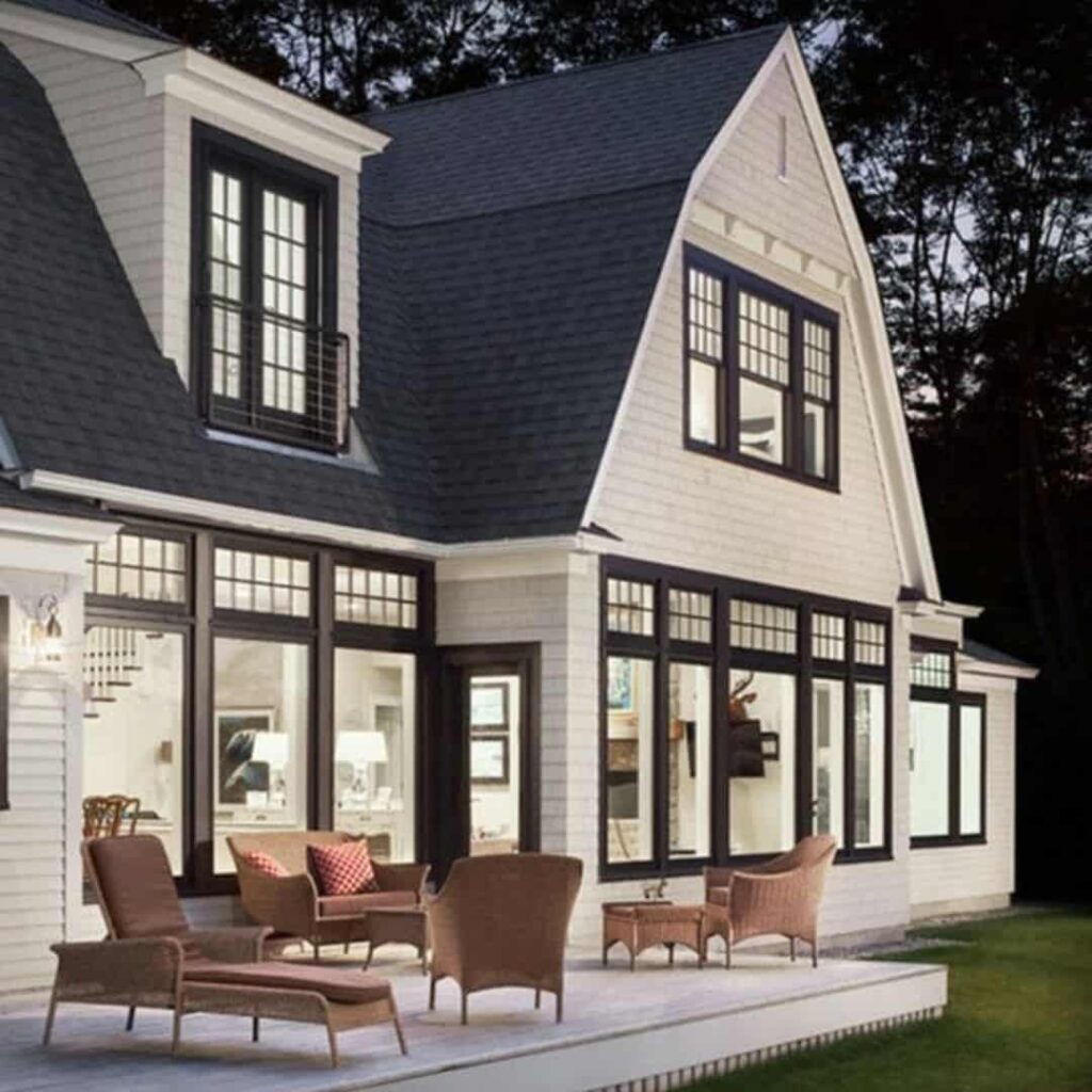 an image showing Tan house with black elements