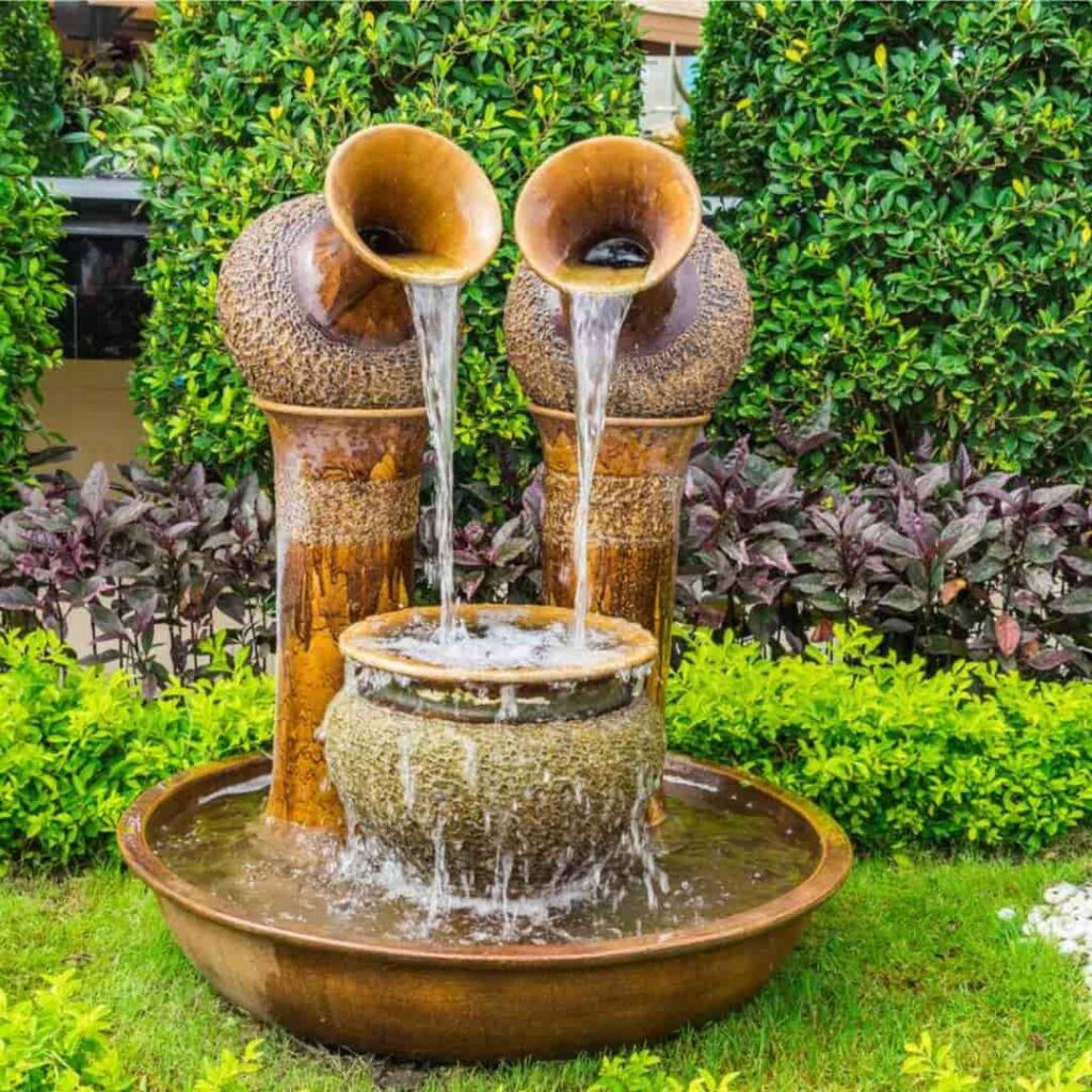 an image showing small water oasis in a fairytale inspired garden