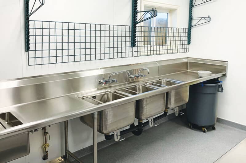 Water In The Wash Sink Of A Three-Compartment