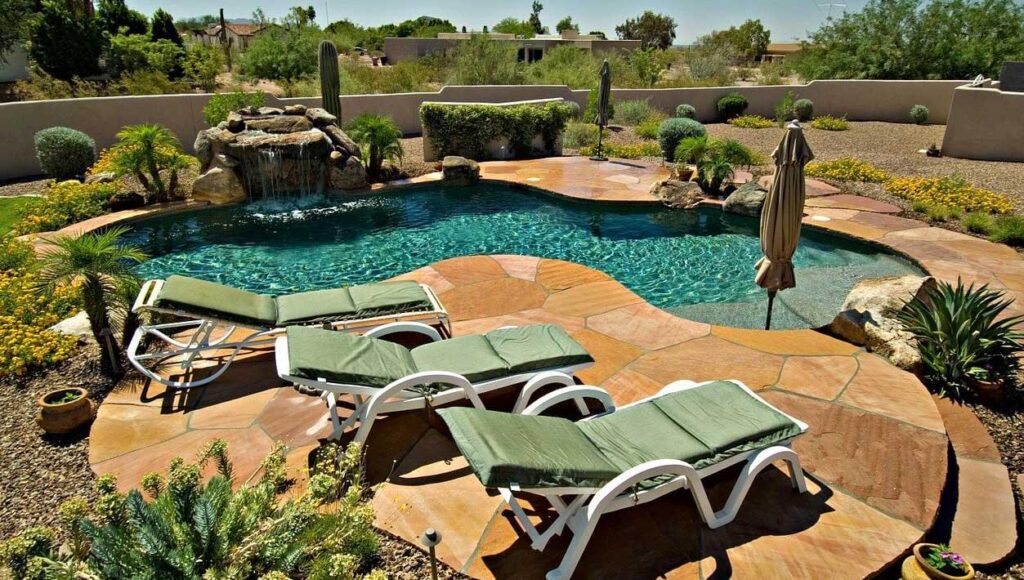 Sun chair and inground pool and a plants