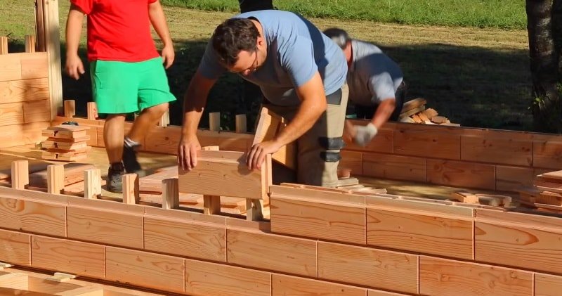 A man building a brikawood home