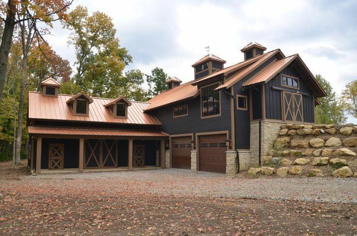 black barndominium with wooden roof