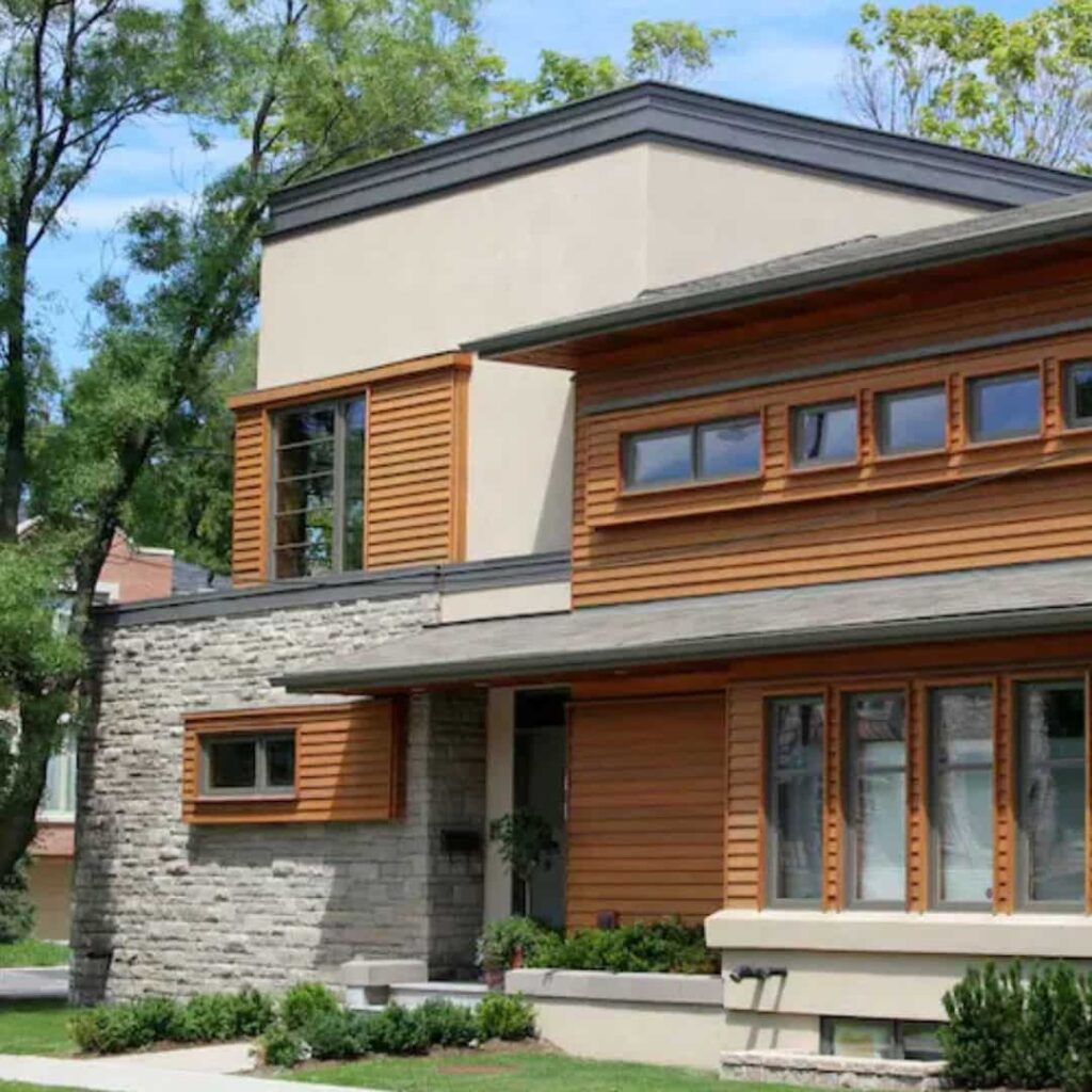 Light gray and dark gray house with cedar accents