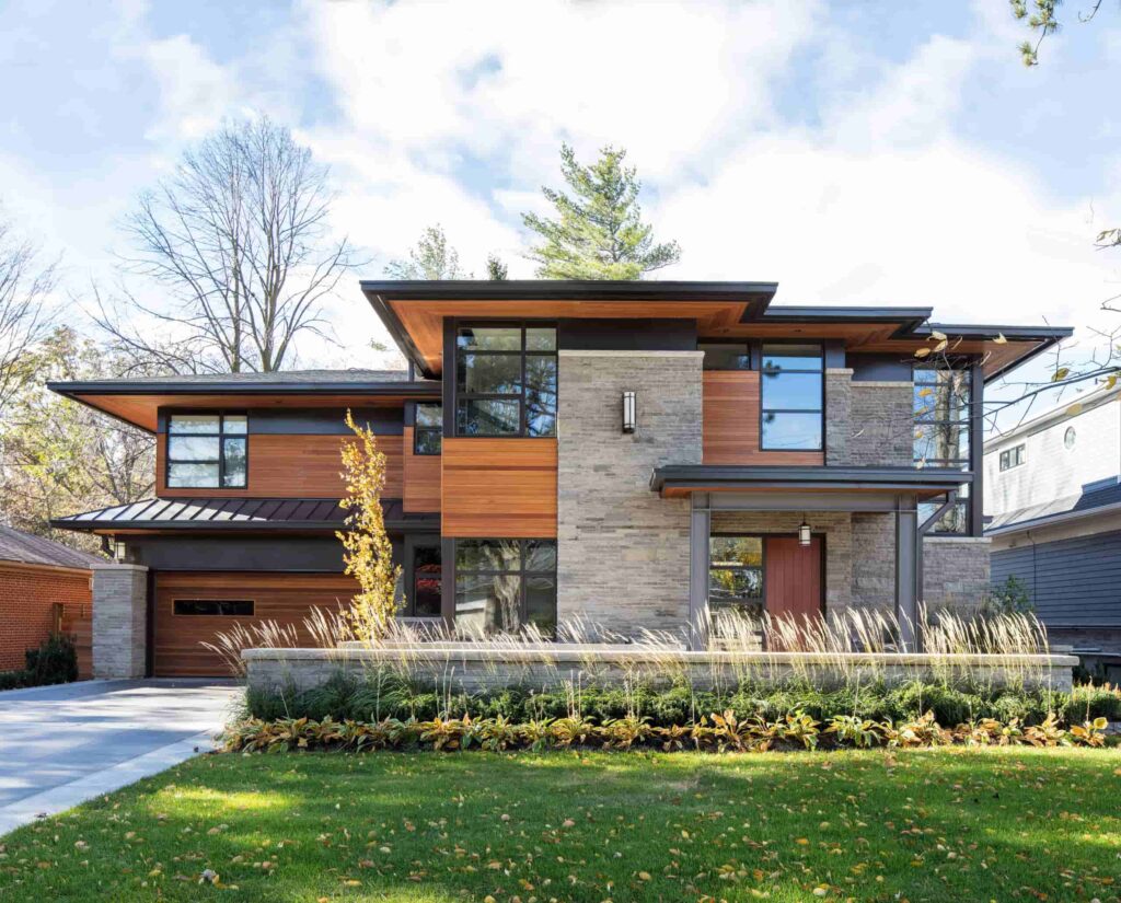 front view of a dark grey house with cedar sidings