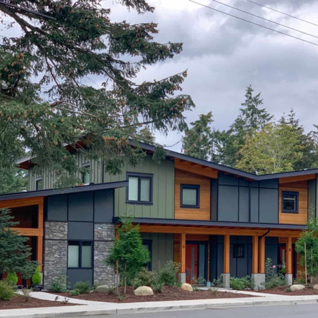 gray and black house with cedar columns