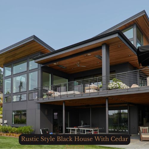 an image of a rustic black house with cedar on ceiling, deck, and columns