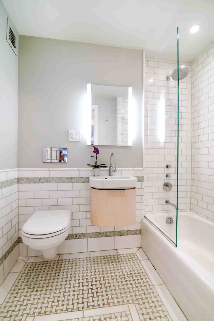 an image of a compact 10x10 bathroom layout with tub, sink, and toilet