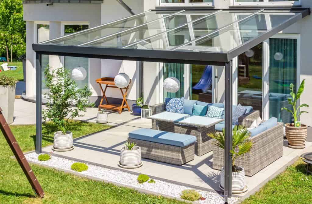 an extended patio roof with glass on top