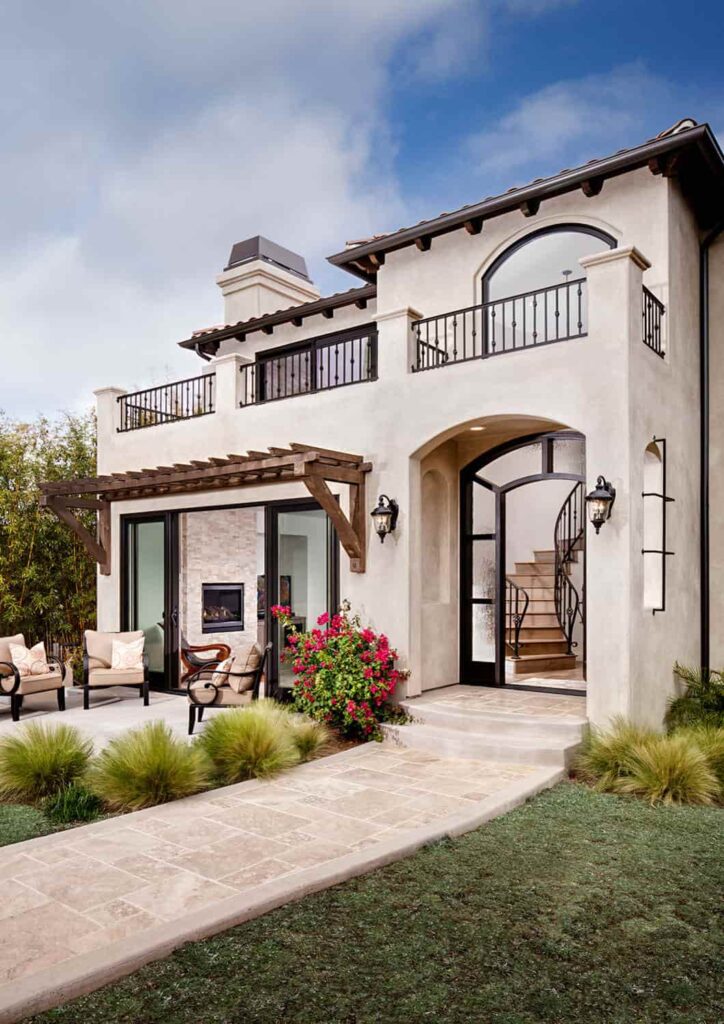an image of a tan house with black and brown trim