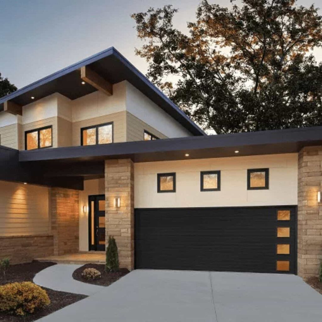 an image of a modern Tan house with black garage door