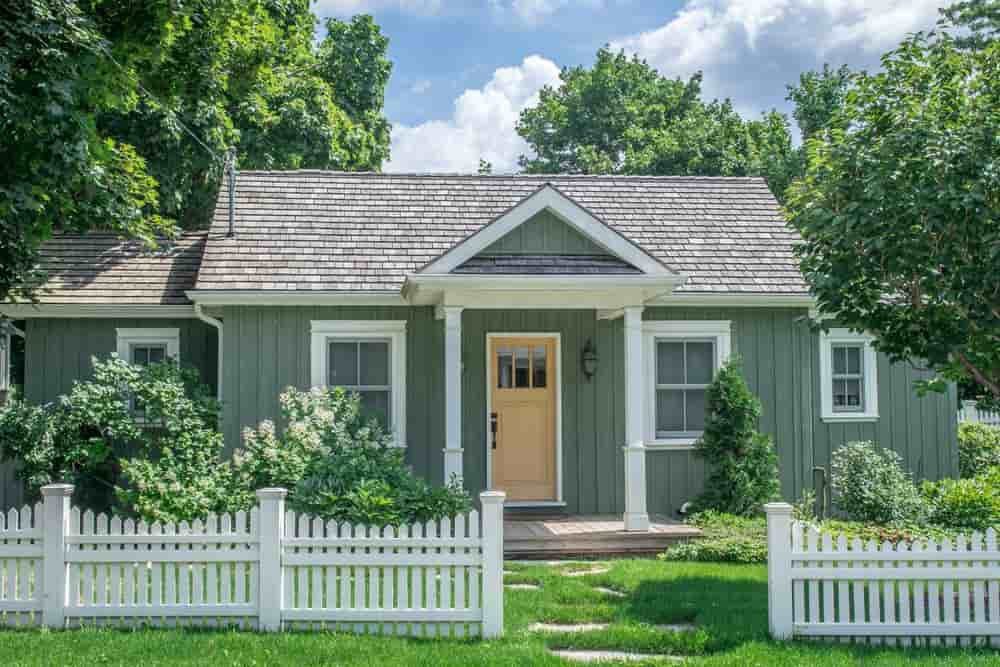 Exterior Sage Green House with white door