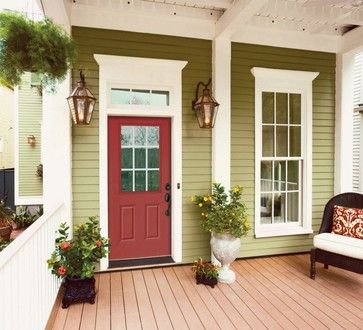 sage green house with red Front Door